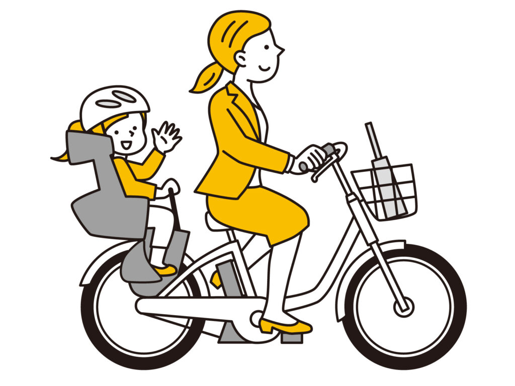 自転車に乗ったスーツの女性と子ども
